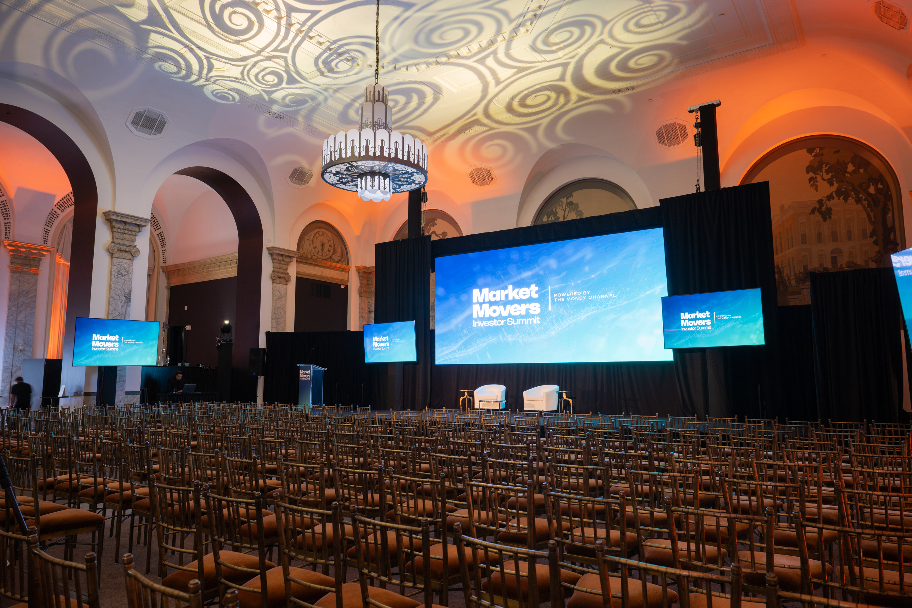 Investor summit conference with theater seating and main stage